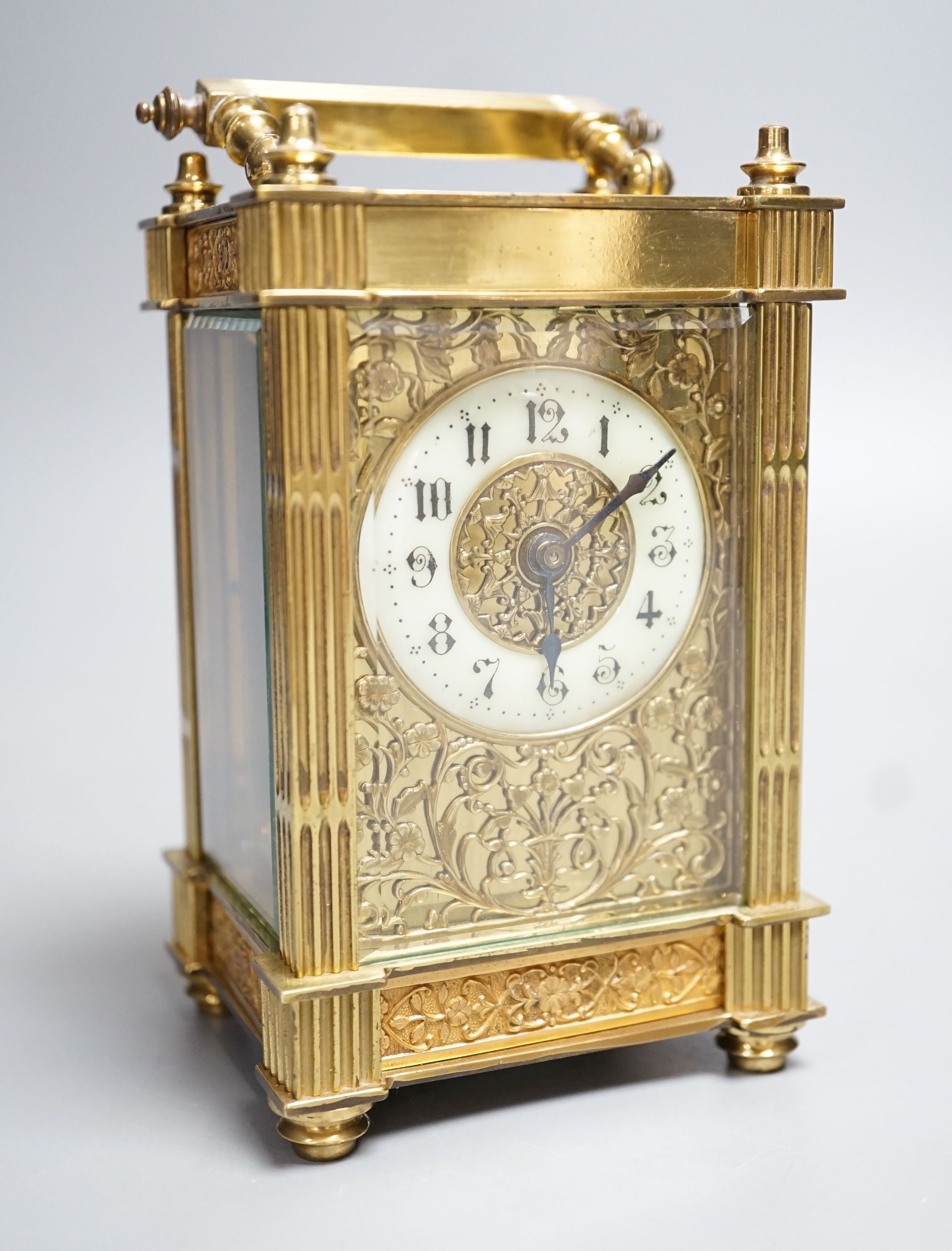 An early 20th century French brass carriage timepiece with fretted dial. 15.5cm